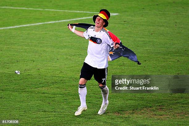 Bastian Schweinsteiger of Germany celebrates victory after the UEFA EURO 2008 Semi Final match between Germany and Turkey at St. Jakob-Park on June...