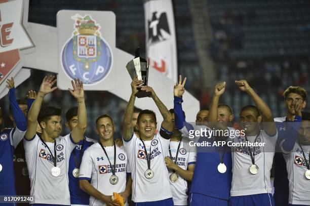 Mexico's Cruz Azul footballers celebrate with the trophy after beating by penalties Portugal's FC Porto during their "Super Copa Tecate" tournament...