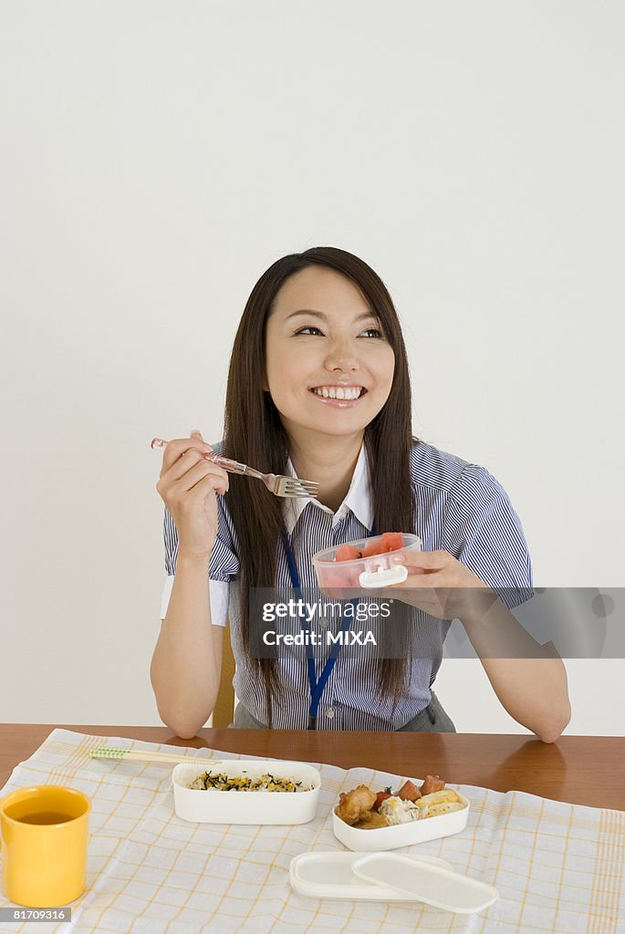 Young woman eating lunch