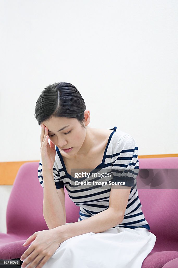 Young woman with a headache