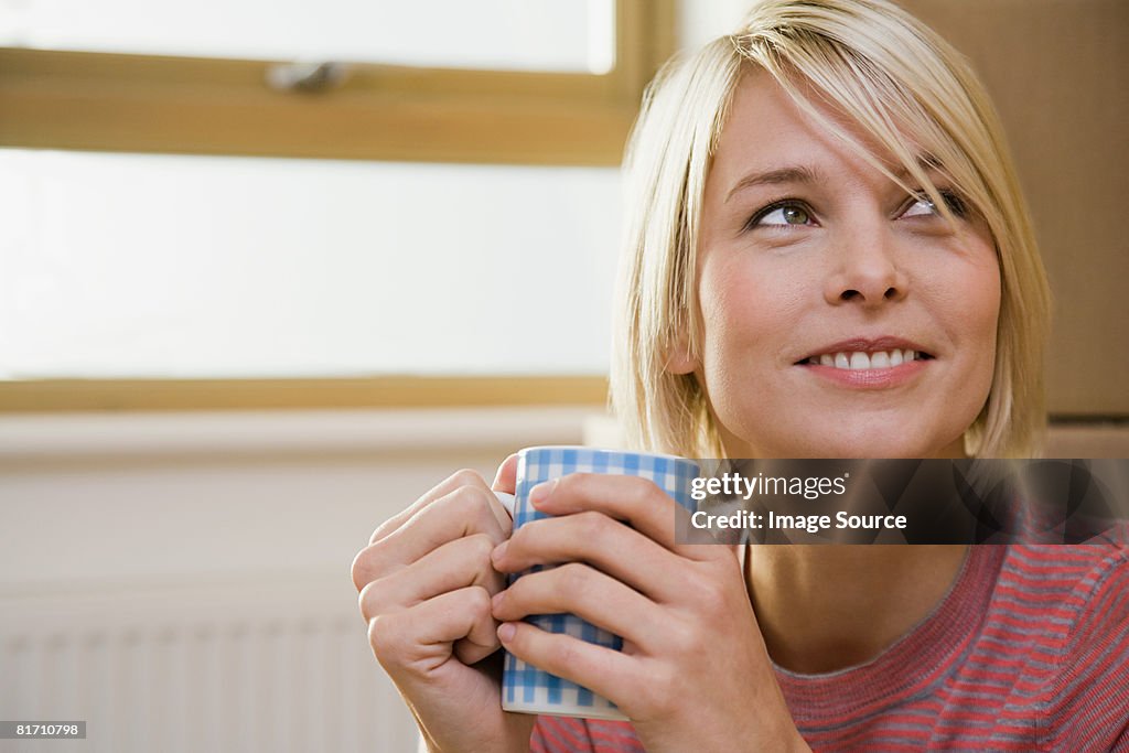 Young woman with coffee cup