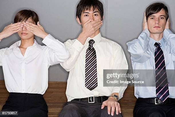 businesspeople covering their eyes mouths and ears - hear no evil stock pictures, royalty-free photos & images