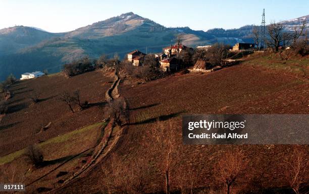 The village of Malino is seen from a distance March 12, 2001 where a unit of the NLA, the Albanian guerilla army in northern Macedonia, has been...