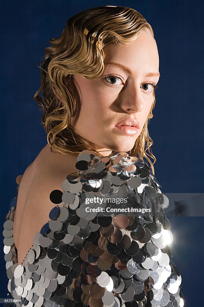 Young woman in sequin dress