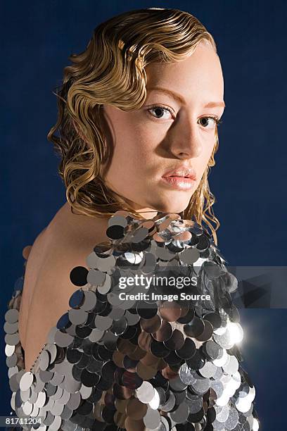 young woman in sequin dress - silver dress fotografías e imágenes de stock