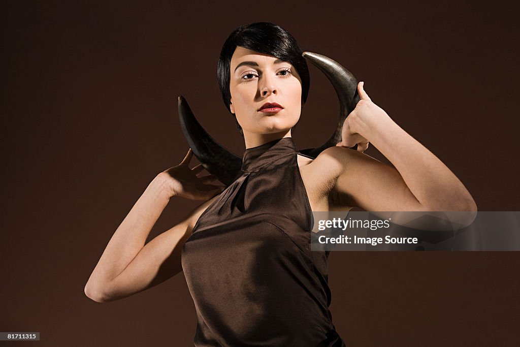 Young woman with animal horn