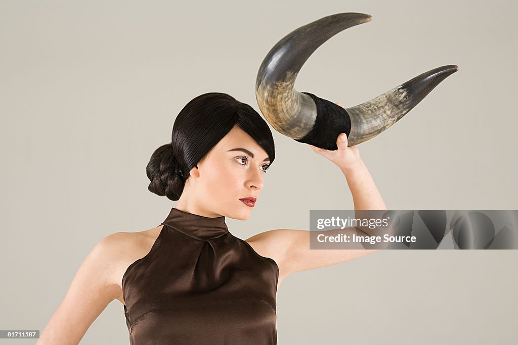 Young woman with animal horn