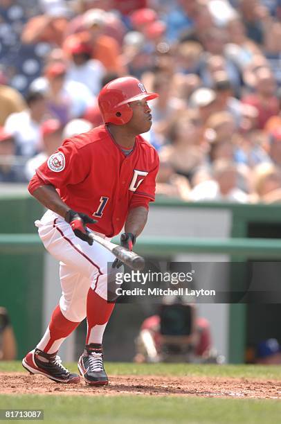 John Lannan of the Washington Nationals hits a home run during a baseball game against the Texas Rangers on June 22, 2008 at Nationals Park in...