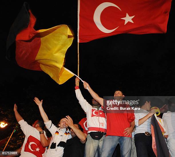 Turkish and German soccer fans celebrate together after the UEFA Euro 2008 semi-final match between Germany and Turkey on June 25, 2008 in Cologne,...