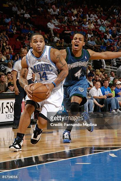 Jameer Nelson of the Orlando Magic drives to the basket against Randy Foye of the Minnesota Timberwolves during the game on April 11, 2008 at Amway...
