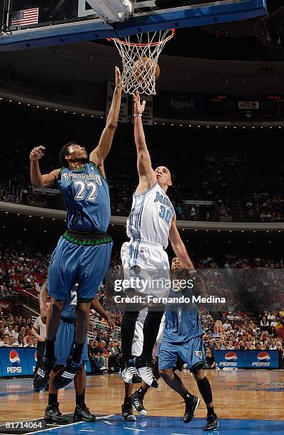 Corey Brewer of the Minnesota Timberwolves goes for the rebound against Carlos Arroyo of the Orlando Magic during the game on April 11, 2008 at Amway...