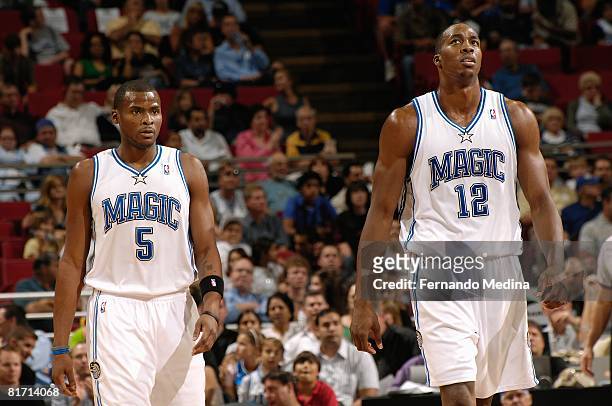 Keyon Dooling and Dwight Howard of the Orlando Magic walk on the court during the game against the Minnesota Timberwolves on April 11, 2008 at Amway...