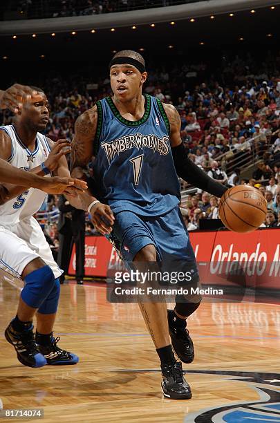 Rashad McCants of the Minnesota Timberwolves drives against Keyon Dooling of the Orlando Magic during the game on April 11, 2008 at Amway Arena in...