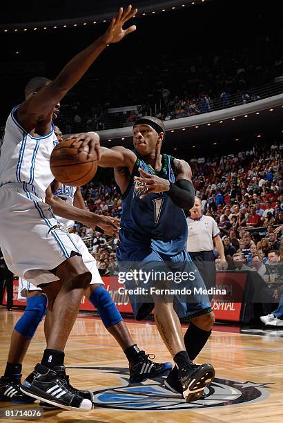 Rashad McCants of the Minnesota Timberwolves passes the ball against Dwight Howard of the Orlando Magic during the game on April 11, 2008 at Amway...