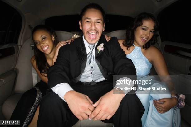 multi-ethnic teenagers in limousine - prom limousine stock pictures, royalty-free photos & images