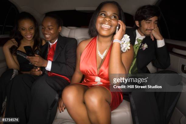 multi-ethnic teenagers in limousine - corsage imagens e fotografias de stock