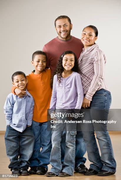 portrait of mixed race family - mixed race man standing studio stockfoto's en -beelden