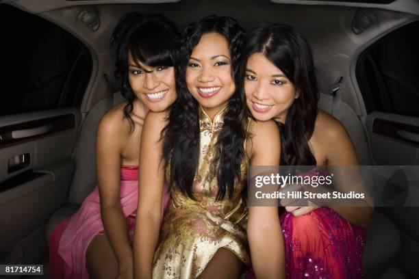 multi-ethnic women in limousine - prom limousine stock pictures, royalty-free photos & images