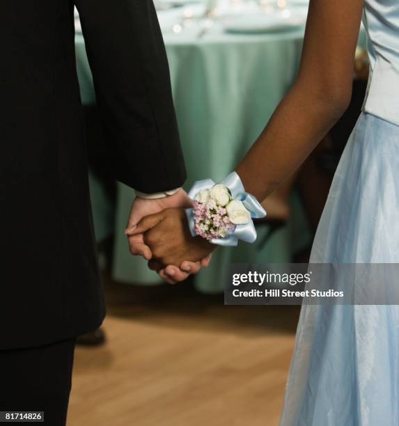 african couple holding hands - high school prom corsage stock pictures, royalty-free photos & images