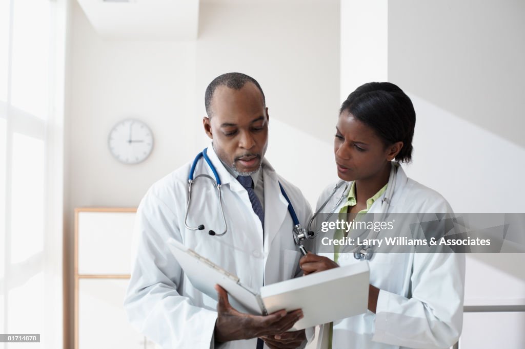 African doctors looking at chart