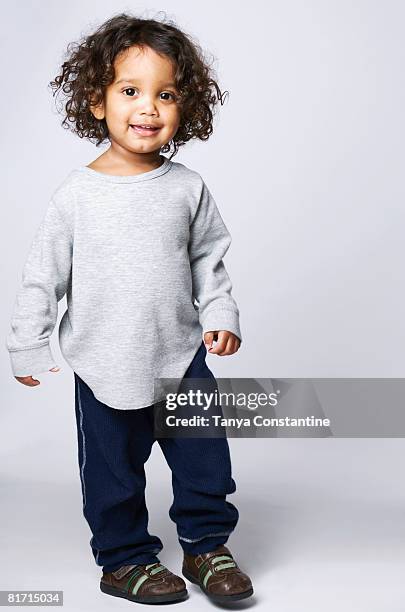 portrait of mixed race boy - boy portrait studio stock pictures, royalty-free photos & images