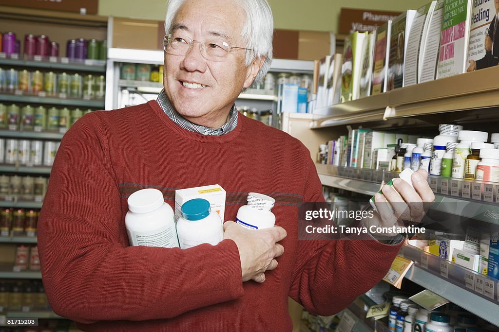Senior Asian man shopping for natural medicine