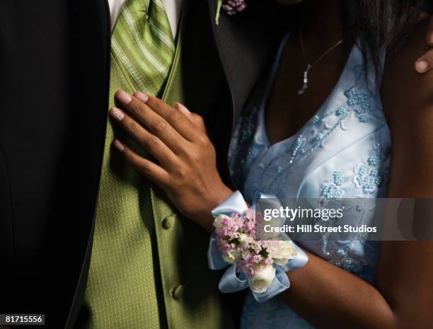 multi-ethnic teenaged couple at prom - corsage imagens e fotografias de stock