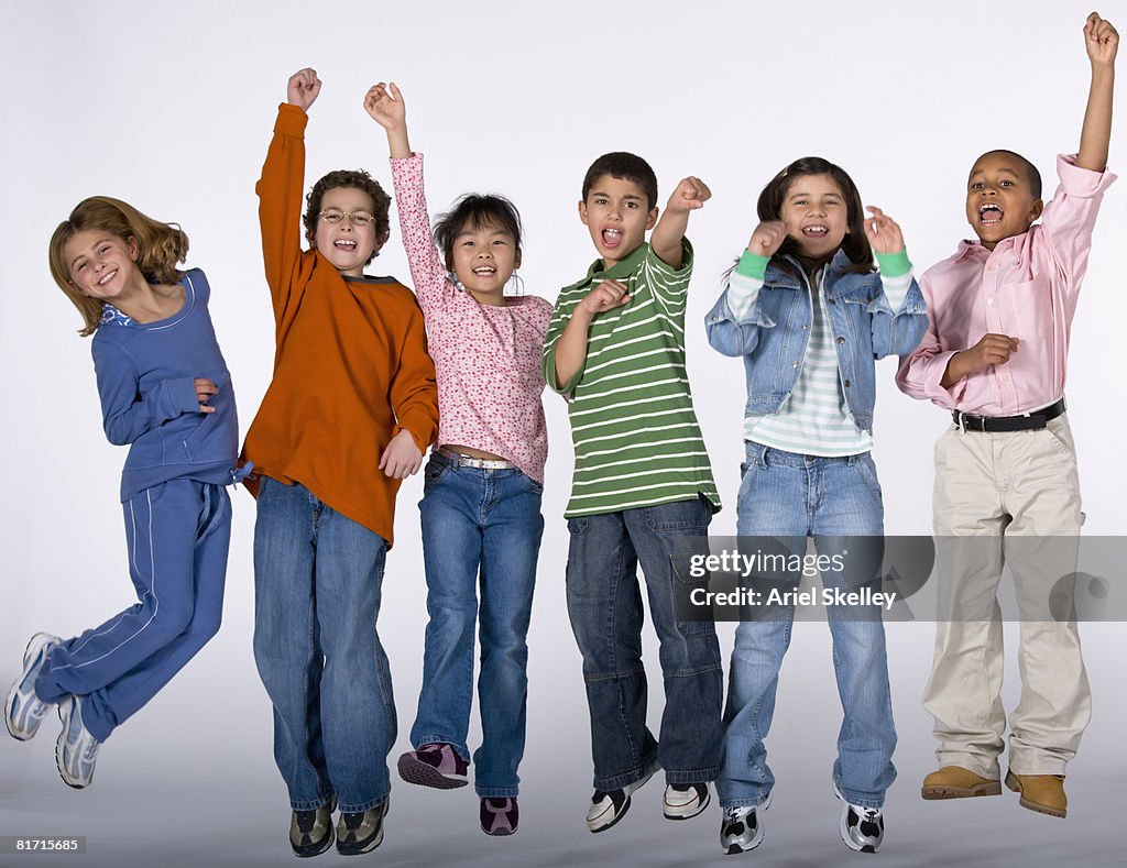 Multi-ethnic children cheering