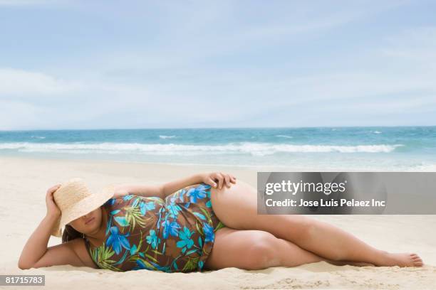 overweight hispanic woman at beach - fat woman at beach stock pictures, royalty-free photos & images