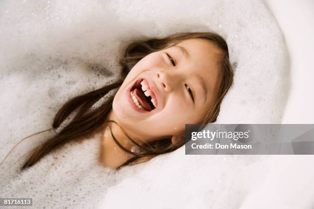 asian girl laughing in bubble bath - underwater room stock pictures, royalty-free photos & images