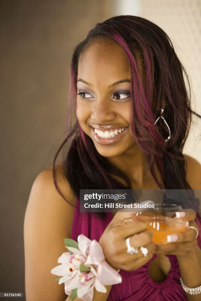 African teenaged girl drinking punch