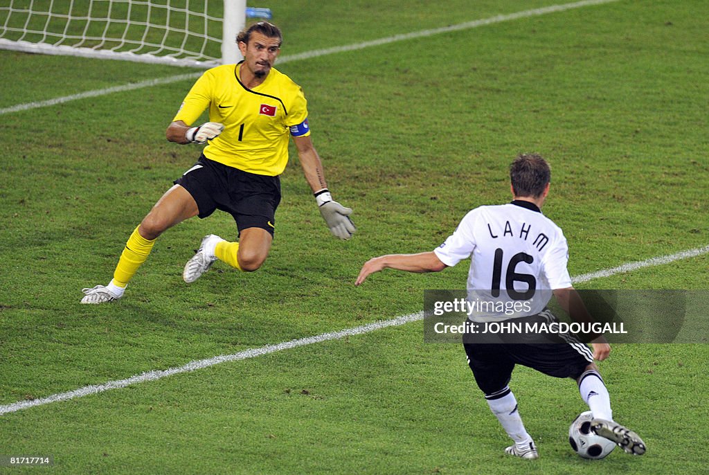 German defender Philipp Lahm (R) scores