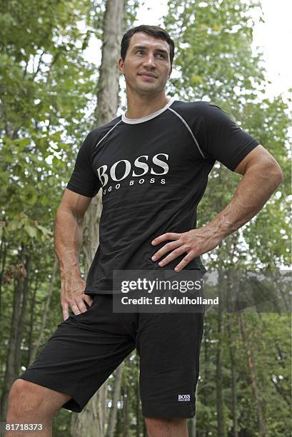 Heavyweight Wladimir Klitschko poses in the woods at Caesar's Paradise Stream Resort after finishing a workout for his upcoming fight against Samuel...