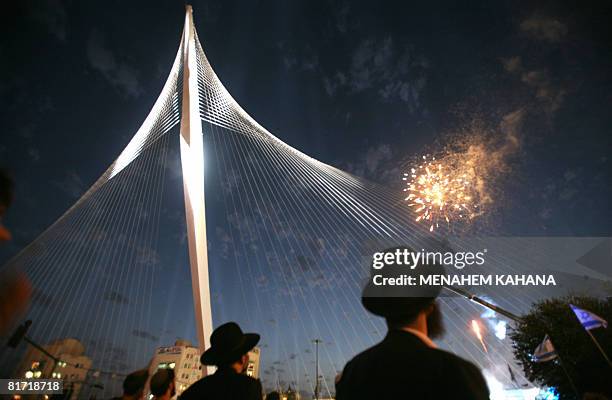 Ultra-Orthodox Jews watch fireworks during the inauguration ceremony of the 'Chords Bridge' , designed by Spanish architect Santiago Calatrava, at...