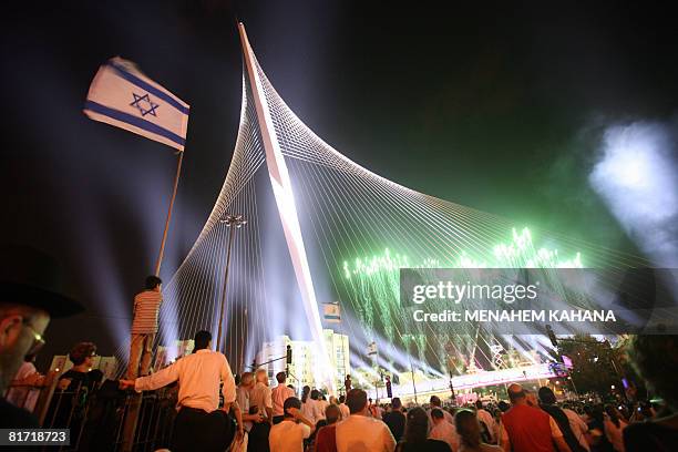 Israelis participate in the inauguration ceremony of the 'Chords Bridge' , designed by Spanish architect Santiago Calatrava, at the main entrance of...