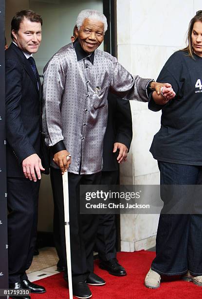 Nelson Mandela leaves the InterContinental Hotel after a photoshoot with celebrity photographer Terry O'Neil on June 26, 2008 in London, England....