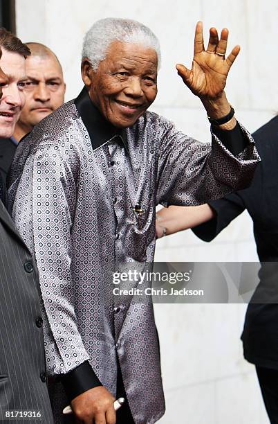 Nelson Mandela leaves the InterContinental Hotel after a photoshoot with celebrity photographer Terry O'Neil on June 26, 2008 in London, England....