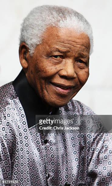 Nelson Mandela leaves the InterContinental Hotel after a photoshoot with celebrity photographer Terry O'Neil on June 26, 2008 in London, England....