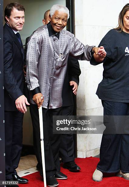 Nelson Mandela leaves the InterContinental Hotel after a photoshoot with celebrity photographer Terry O'Neil on June 26, 2008 in London, England....