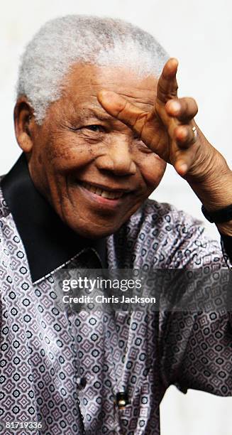 Nelson Mandela leaves the InterContinental Hotel after a photoshoot with celebrity photographer Terry O'Neil on June 26, 2008 in London, England....