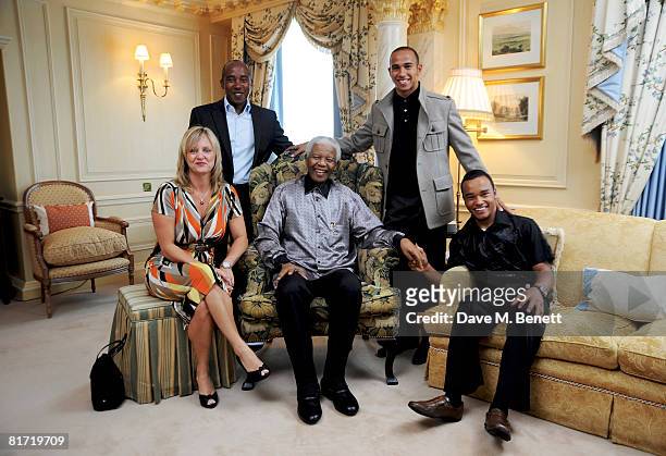 Lewis Hamilton with his father Anthony, stepmother Linda and brother Nicholas Hamilton meet with Nelson Mandela ahead of the 46664 concert being held...