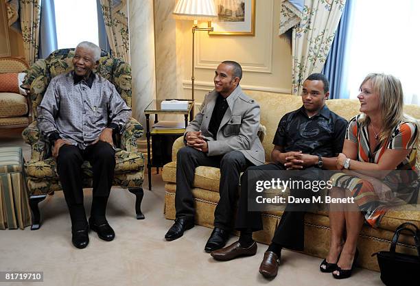 Lewis Hamilton with his brother Nicholas and stepmother Linda meet with Nelson Mandela ahead of the 46664 concert, at the Dorchester Hotel on June...