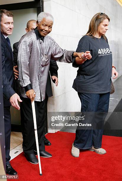 Nelson Mandela with Roland Fasel , General Manager of the The InterContinental Hotel Park Lane, arriving at The InterContinental Hotel Park Lane...