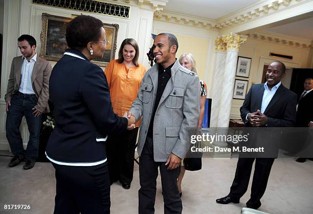Lewis Hamilton meets with Graca Machel ahead of the 46664 concert being held in Hyde Park on Friday the 27th of June, at the Dorchester Hotel on June...