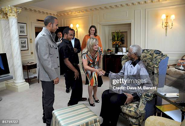 Lewis Hamilton with his father Anthony, stepmother Linda and brother Nicholas Hamilton meet with Nelson Mandela ahead of the 46664 concert being held...