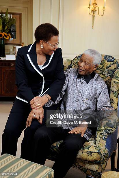 Nelson Mandela and his wife Graca Machel pose ahead of the 46664 concert being held in Hyde Park on Friday the 27th of June in his honour, at the...