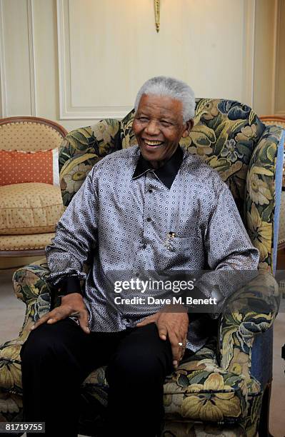 Nelson Mandela poses ahead of the 46664 concert being held in Hyde Park on Friday the 27th of June in his honour, at the Dorchester Hotel on June 24,...