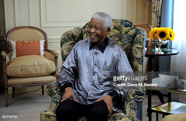Nelson Mandela poses ahead of the 46664 concert being held in Hyde Park on Friday the 27th of June in his honour, at the Dorchester Hotel on June 24,...