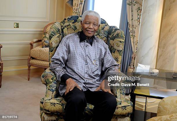 Nelson Mandela poses ahead of the 46664 concert being held in Hyde Park on Friday the 27th of June in his honour, at the Dorchester Hotel on June 24,...