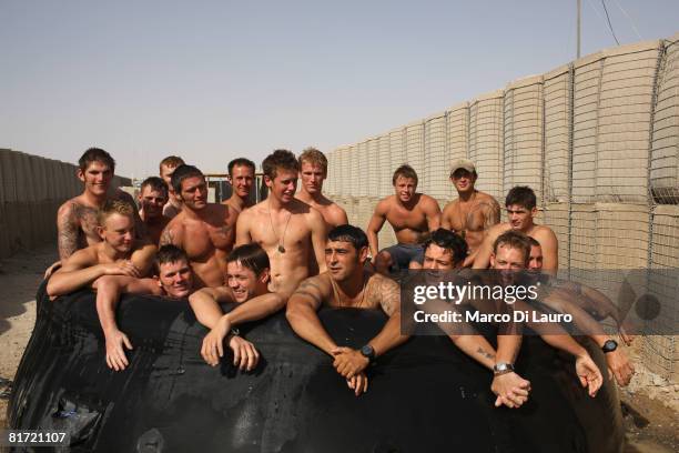 British paratroopers from 3rd Battalion The Parachute Regiment are seen at a pool and bbq party organize during their downtime on June 24, 2008 at...